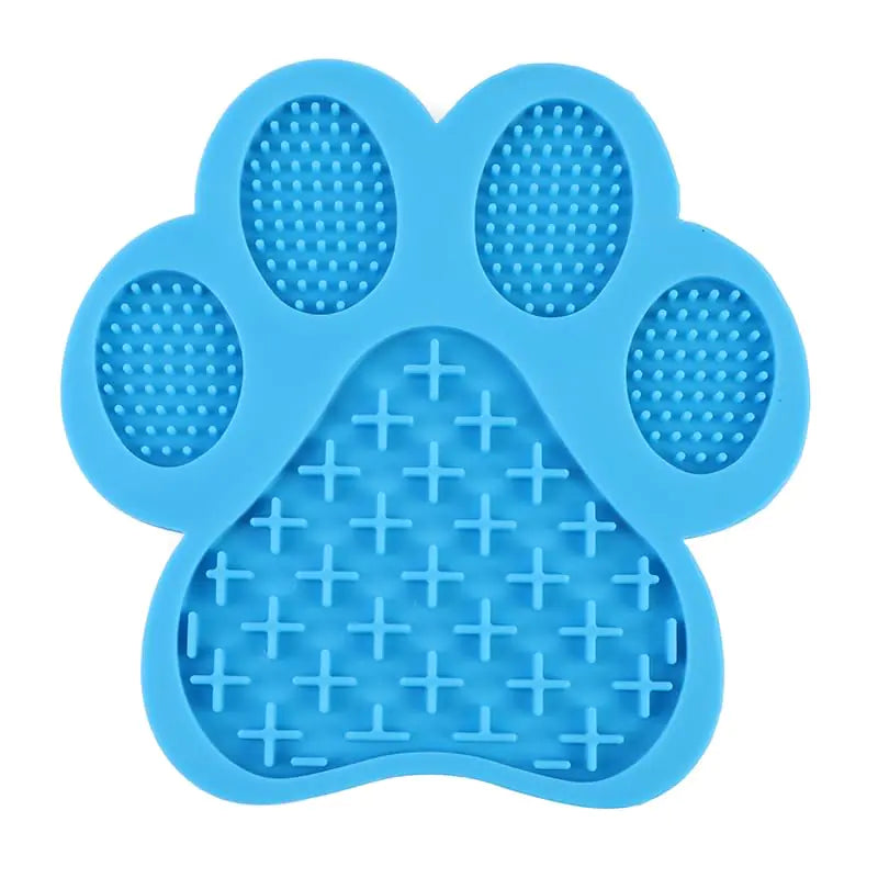 Blue paw-shaped lick mat, slow-feeder with textured surface on a white background