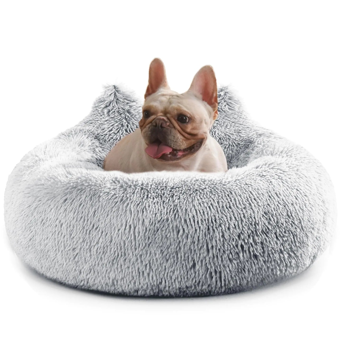 Dog lying on a fluffy gray pet bed against a white background