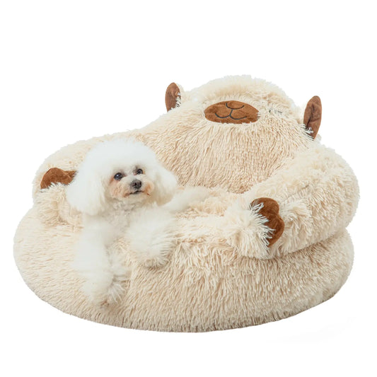 Dog lying on a fluffy sheep-shaped pet bed with a white background