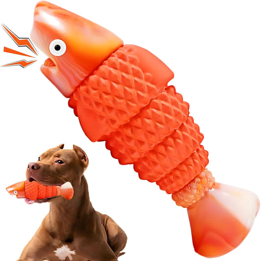 Dog playing with an orange fish-shaped toy on a white background