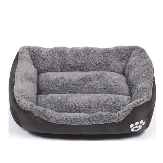 Gray pet bed with a paw print logo on a white background
