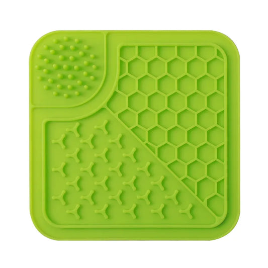Green silicone mat with textured surface on a white background