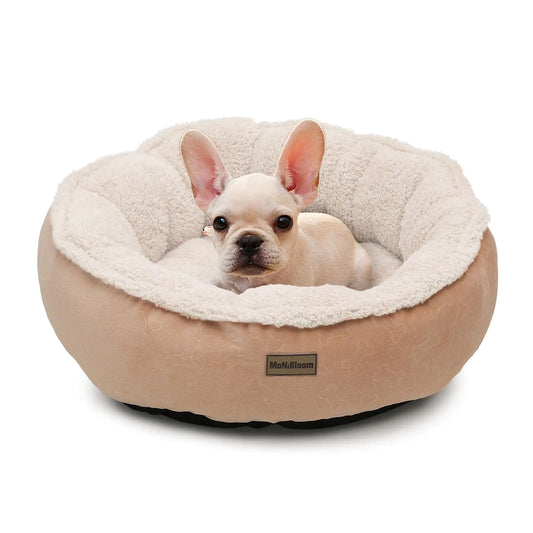 Small dog lying on a beige pet bed with a white interior