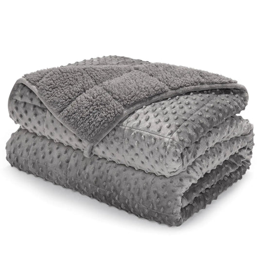 Stack of gray textured blankets on a white background